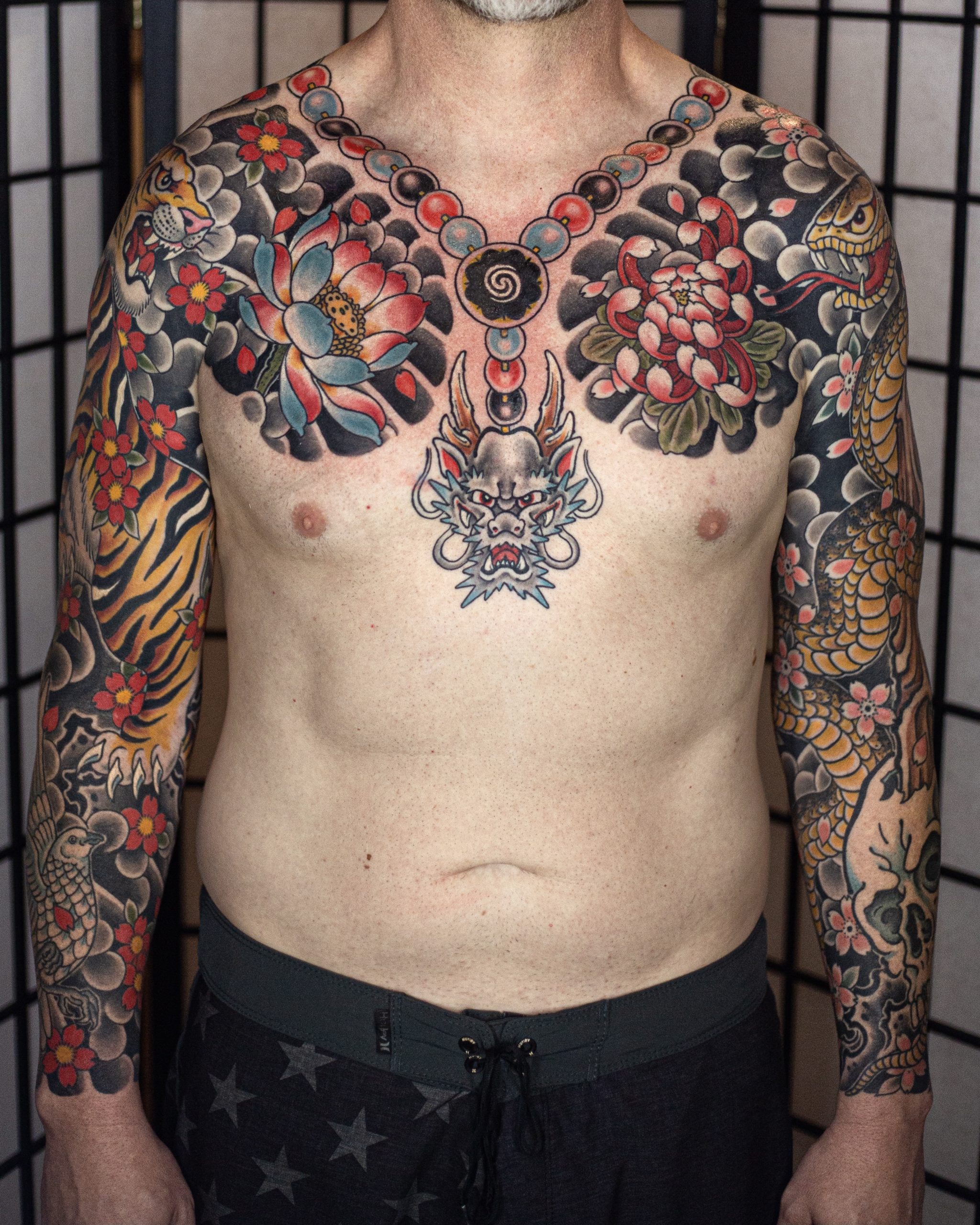 https://chapteronetattoo.com/wp-content/uploads/2022/03/traditional-japanese-sleeves-and-chest-tattoo.jpg