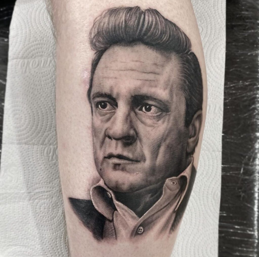 Johnny Cash portrait tattoo by Darigo Bonatto